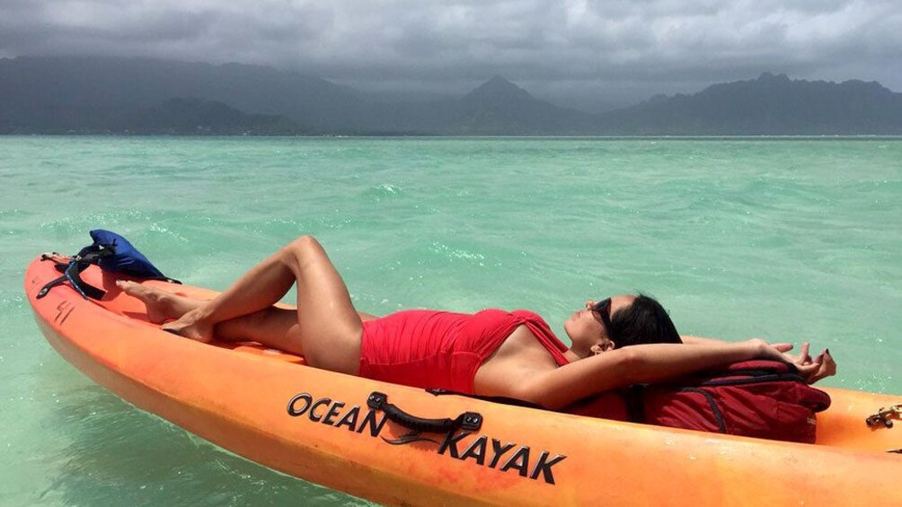 Show item 1 of 6. Woman sunbathing on a kayak on Oahu