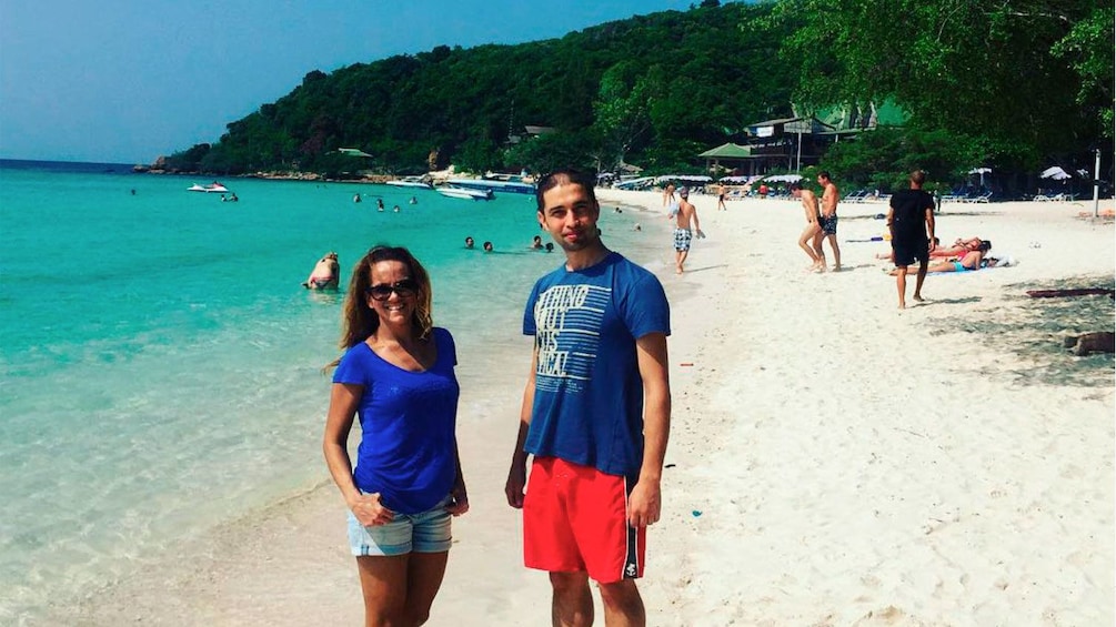 Show item 4 of 5. Couple on a beach on Coral Island