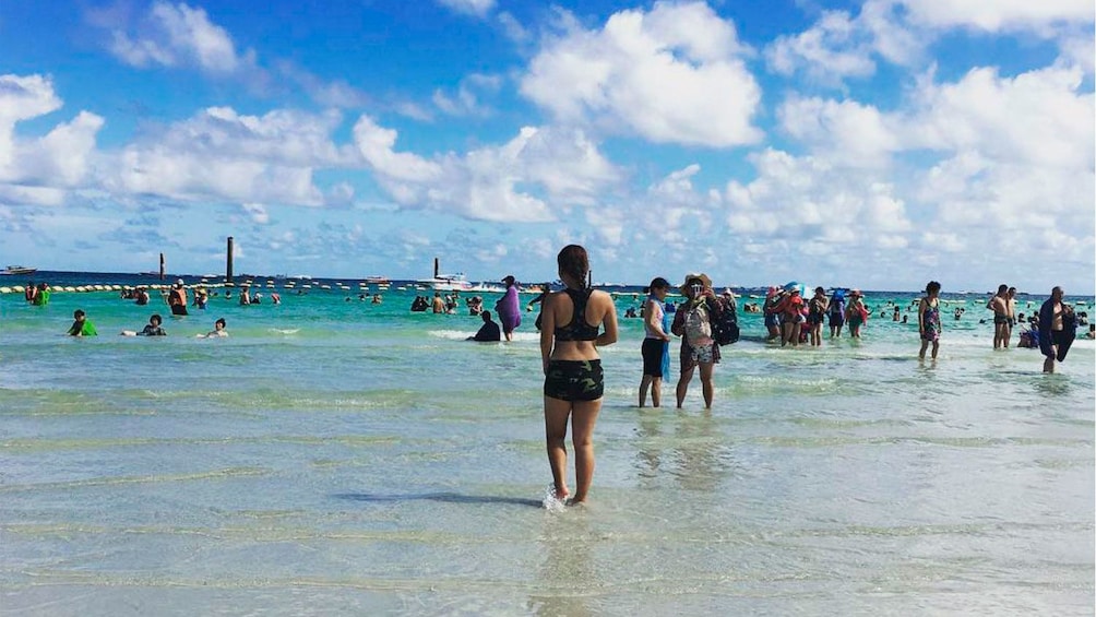 Show item 5 of 5. Beachgoers on Coral Island