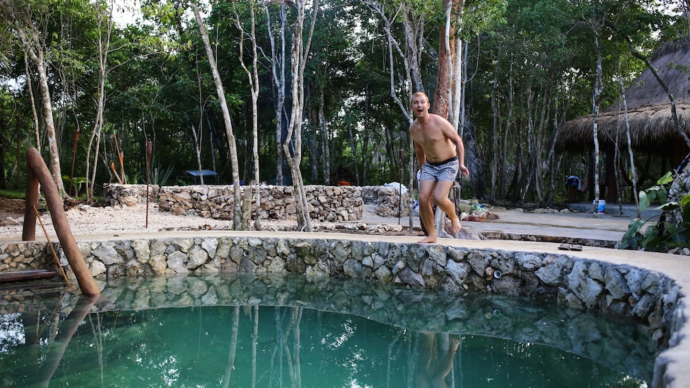 Man about to jump into a pool