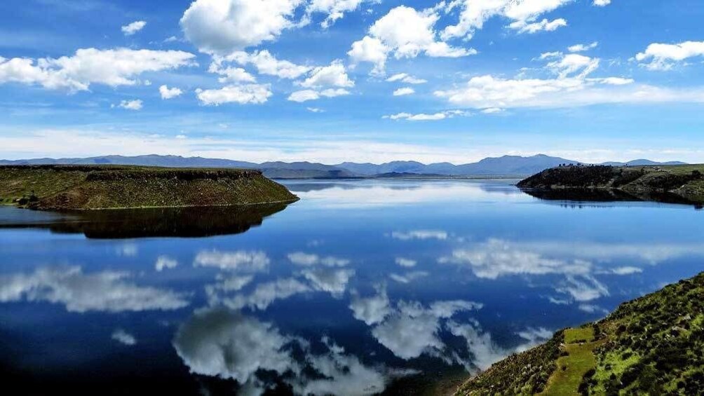 clouds reflecting from the lake in Lima