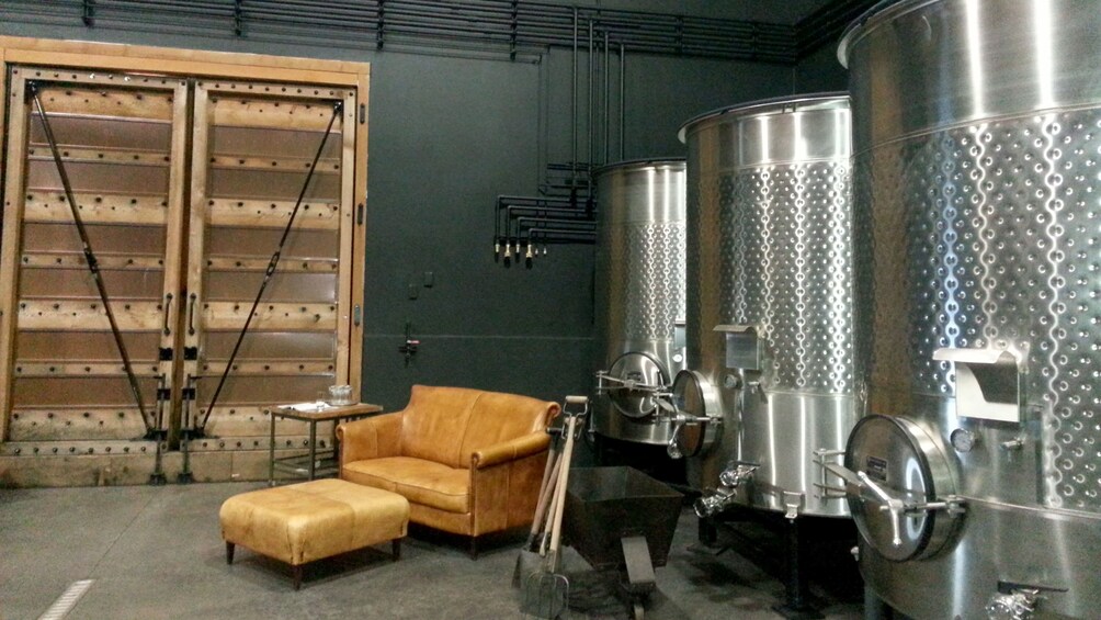 Large vats and seating inside a winery in Portland