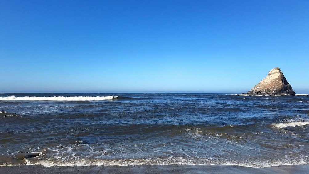 Waves rolling in at beach in Oregon