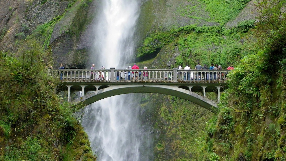 Tourists visiting Multnomah Falls in Portland, Oregon 