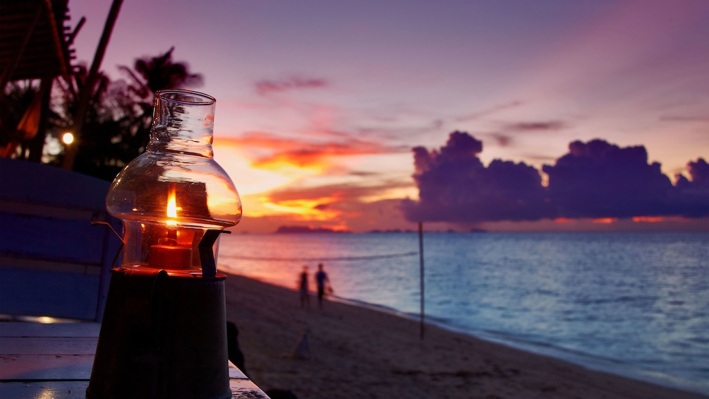 Lantern on the beach at sunset in Koh Samui