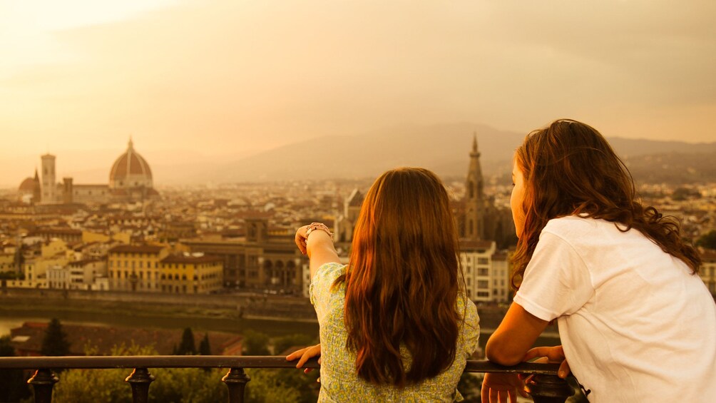 Mother and daughter observing Florence at sunset.