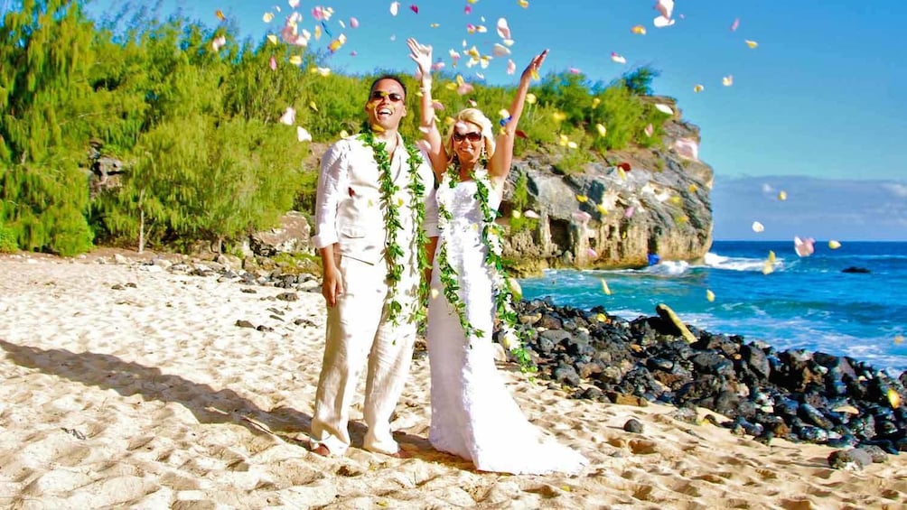 Happy couple celebrating on the beach