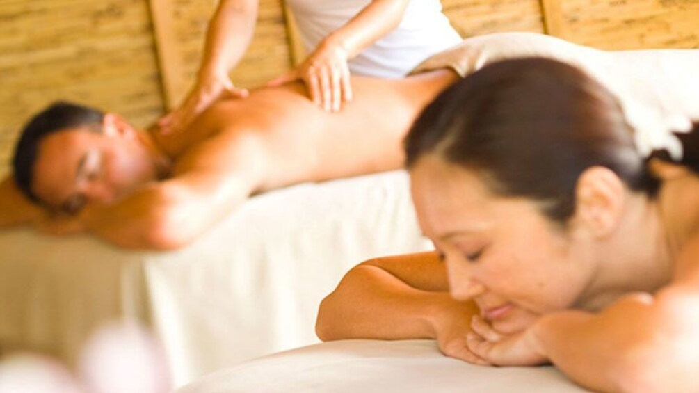 Show item 2 of 7. Couple getting massages in Kauai