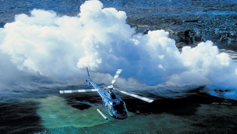 Show item 3 of 9. Helicopter flying over hawaii
