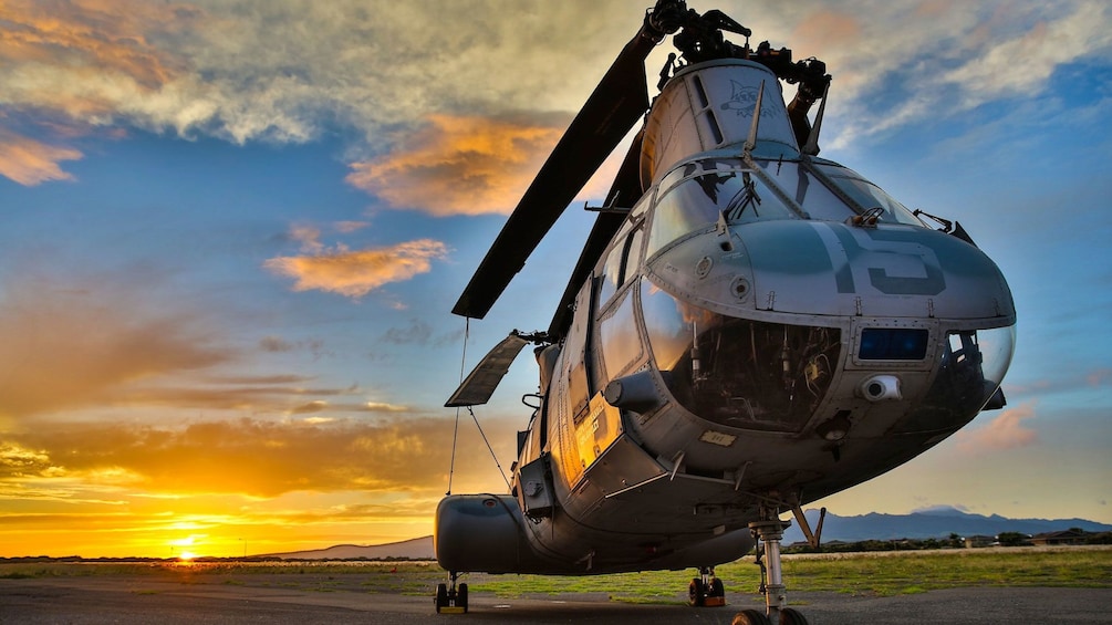 Helicopter stationed at the Pacific Aviation Museum during sunset