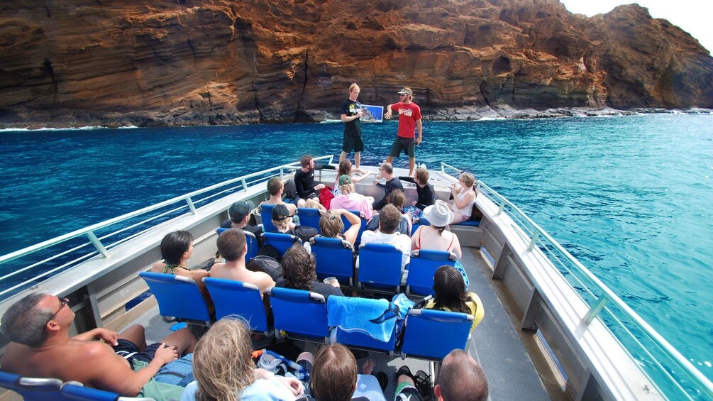 Show item 4 of 8. Tour guides giving presentation to audience on the Molokini Wild Side Eco Adventure in Maui