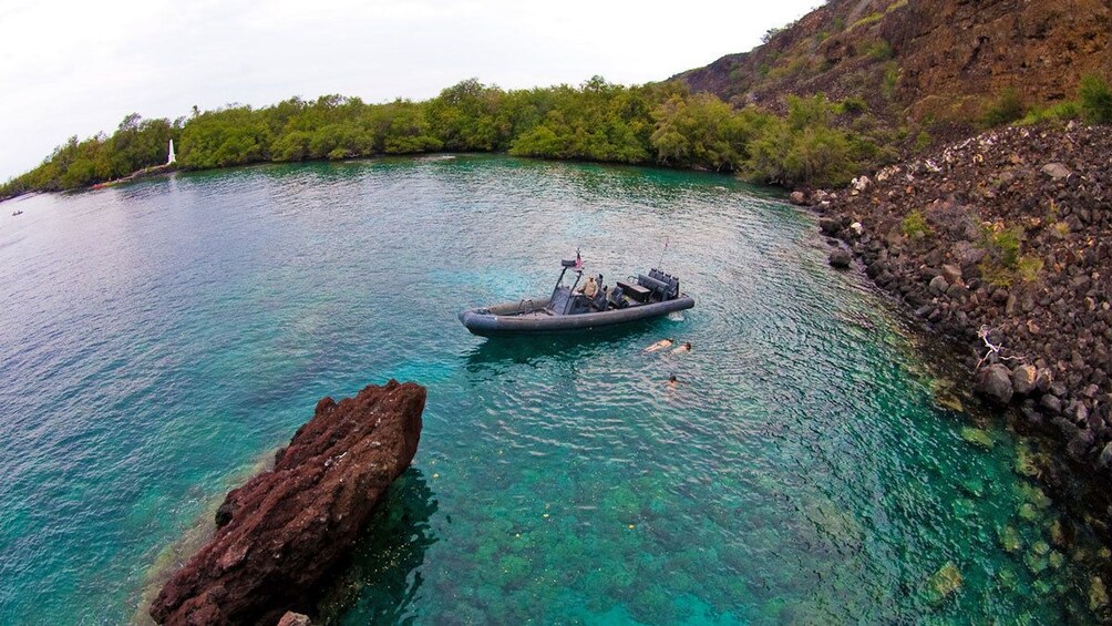 Kayakers swimming in the coral reef in Hawaii