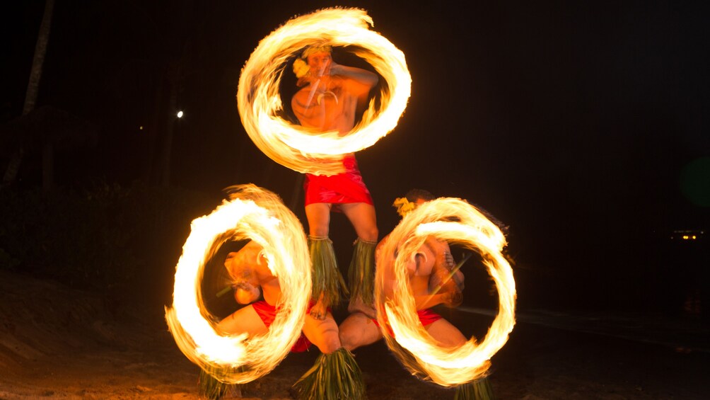 Trio of fire twirlers at Drums of the Pacific Luau