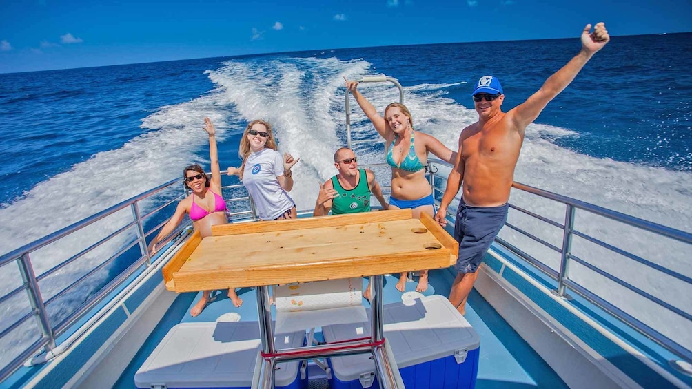 people happy on deck of boat in hawaii