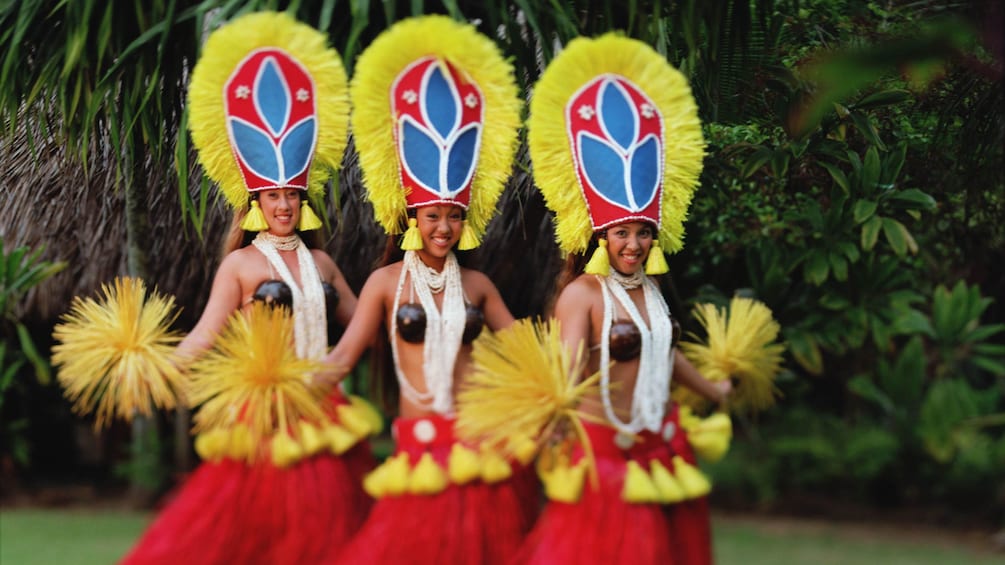 three Hula dancers at luau in Kauai