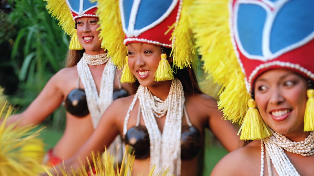 three Hula dancers at luau in Kauai