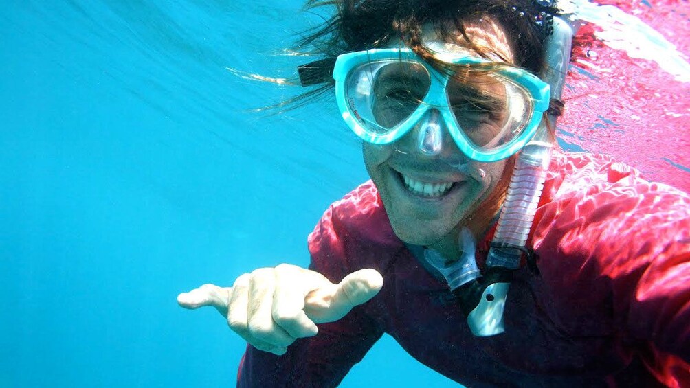 snorkeler signaling in the water in Maui