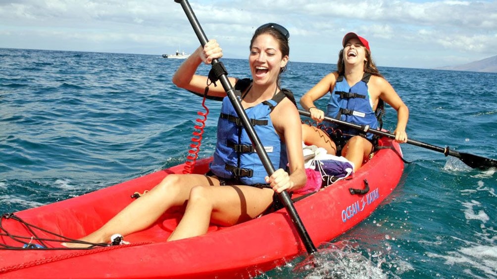 women having a blast while kayaking in Maui