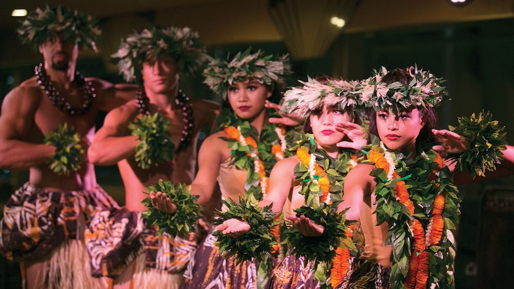 Performers in traditional dress on Sunset Cruise