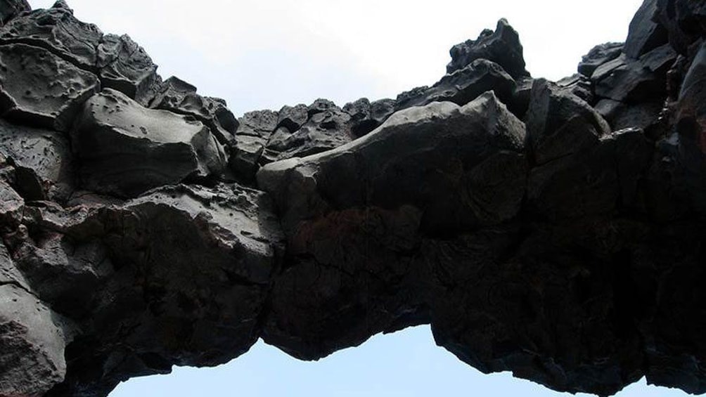 large black rocks on the shore of hawaii