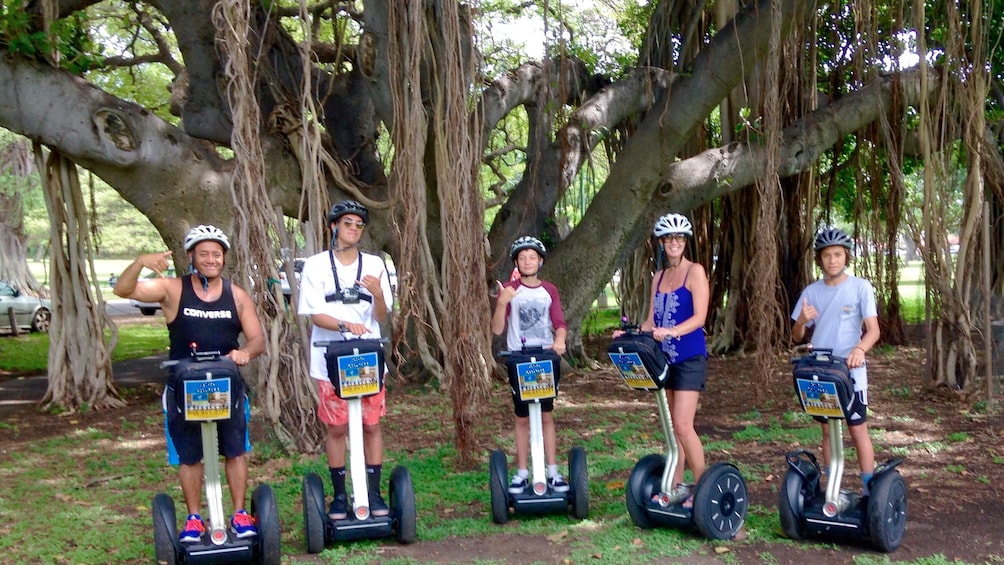 Family embarking on a segway tour through Kapiolani Park in Hawaii