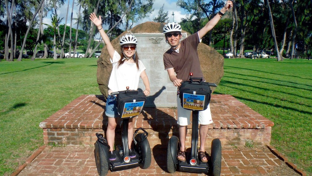 Couple posing for a photo op while touring Honolulu on segway