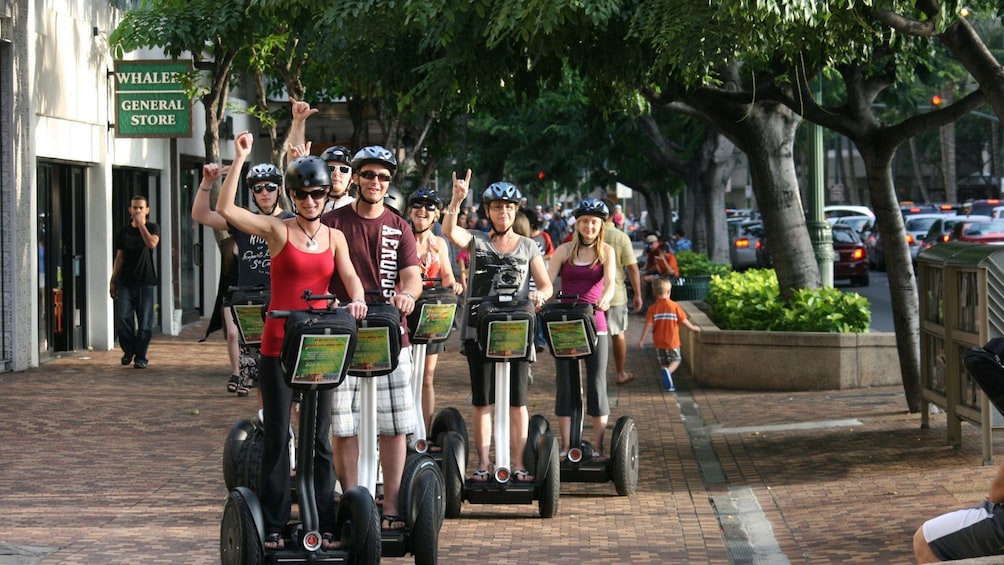 Segway tour group posing on city street in Oahu