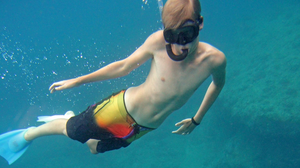 Boy swimming in Kauai
