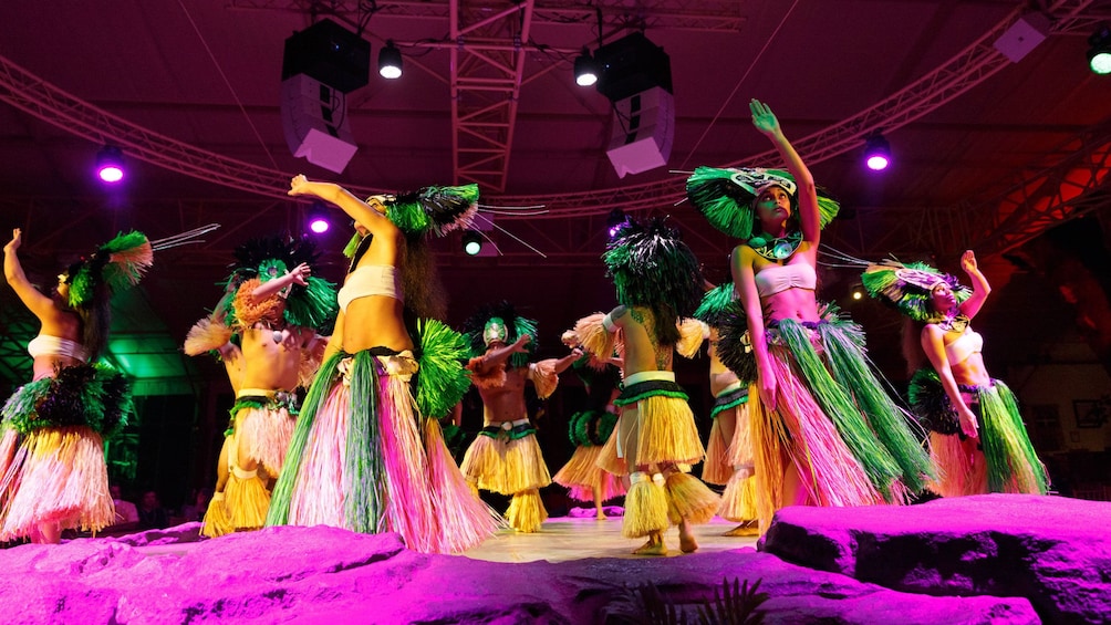 seven Hawaiian dancers dancing at luau in Kauai