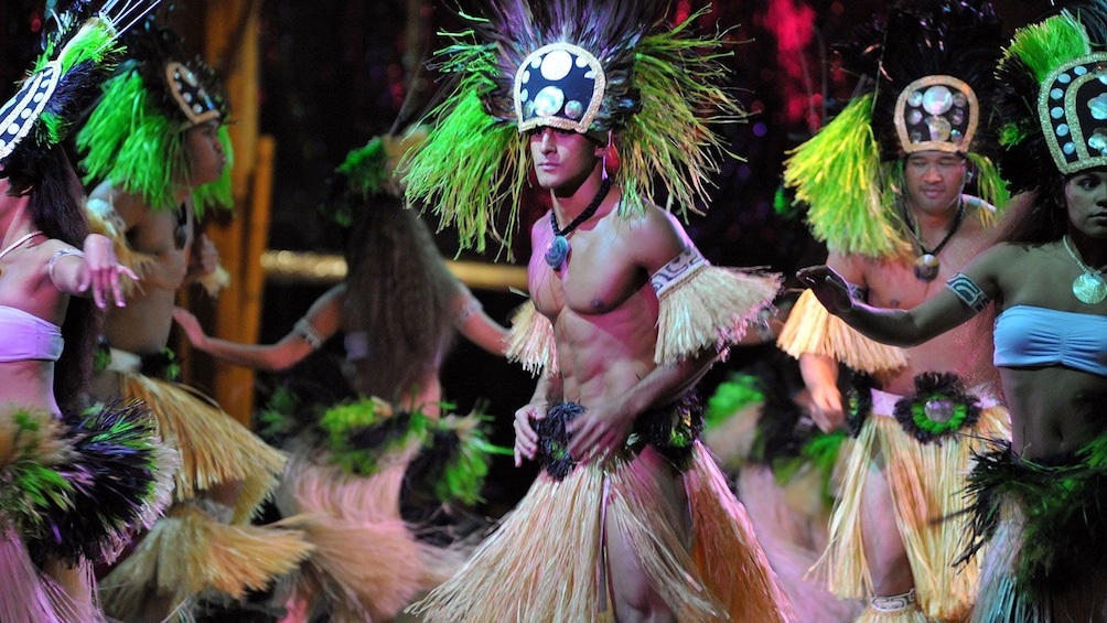 group of Hawaiian dancers dancing at  luau in Kauai