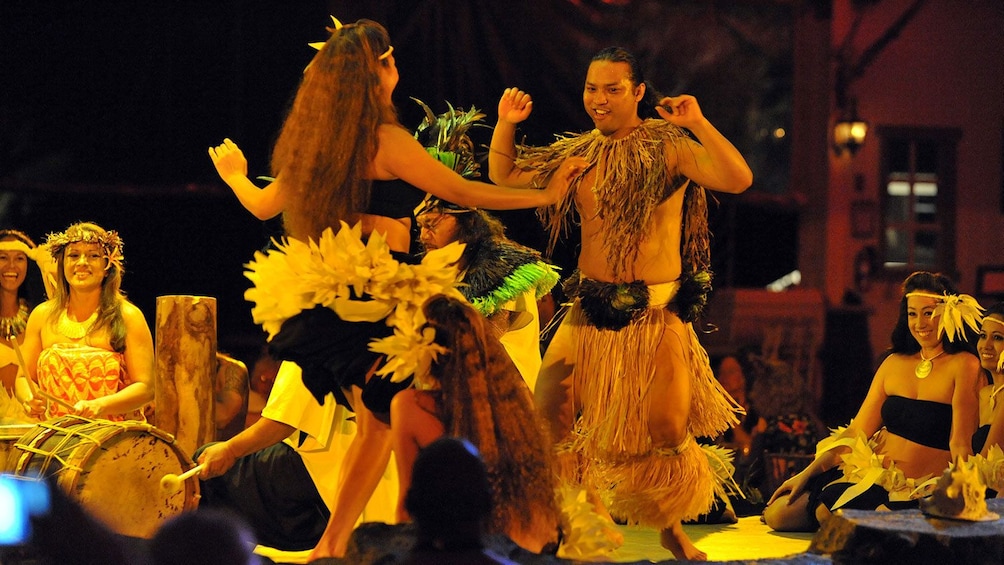 Hawaiian dancers hula dancing at  luau in Kauai