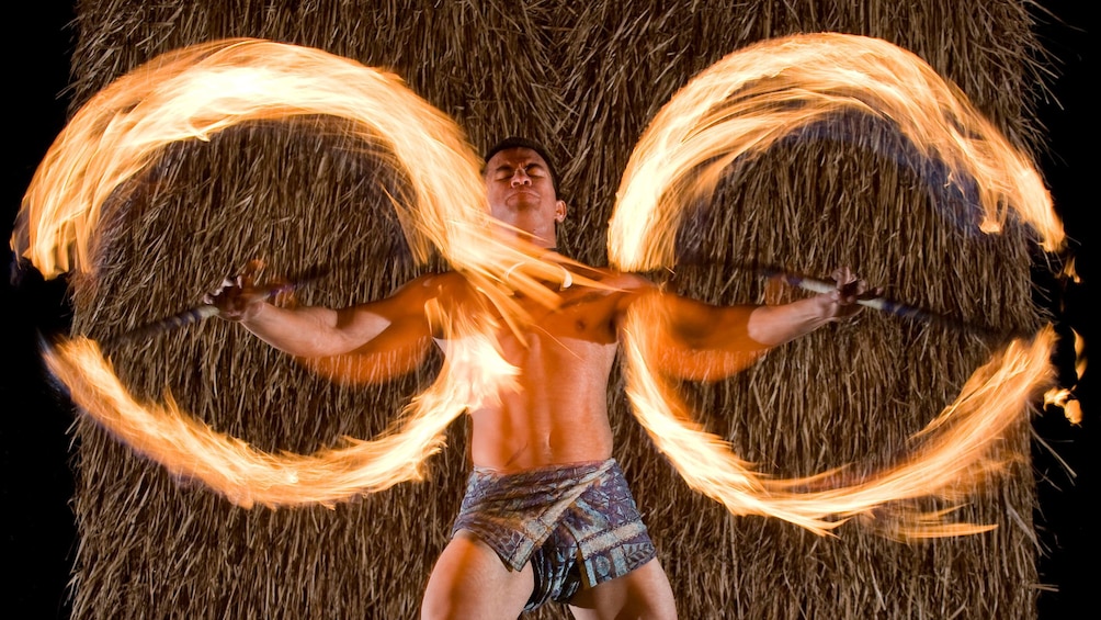 Man fire dancing at the Maui Nui Luau in Maui 