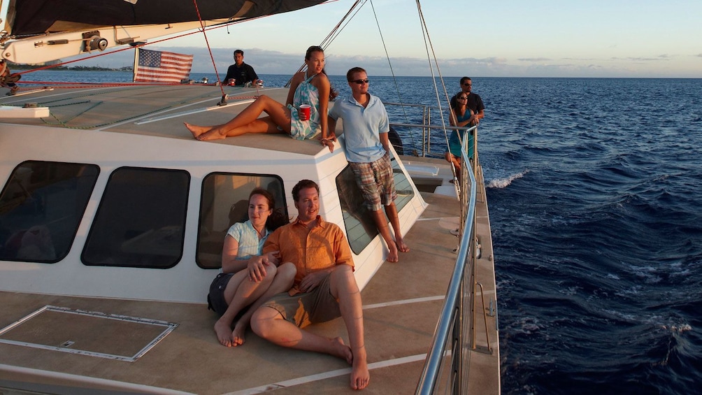 Friends lounging on deck of boat