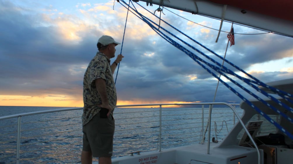 Man looking at ocean from boat