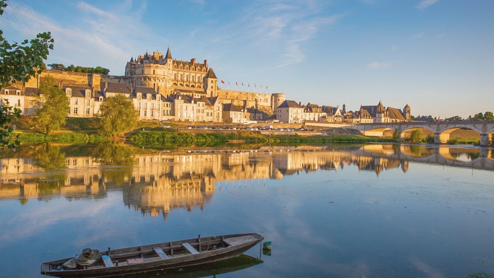 Exterior shot of Amboise castle with lake in view.