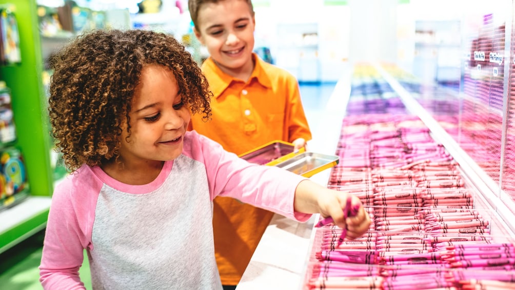 View of child playing in crayola play area.