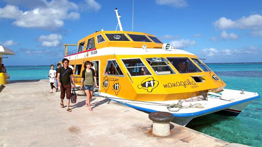walking out of a yellow boat in Micronesia