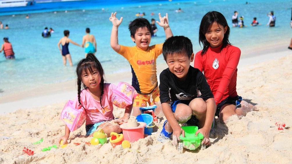 kids playing in the beach sand in Micronesia