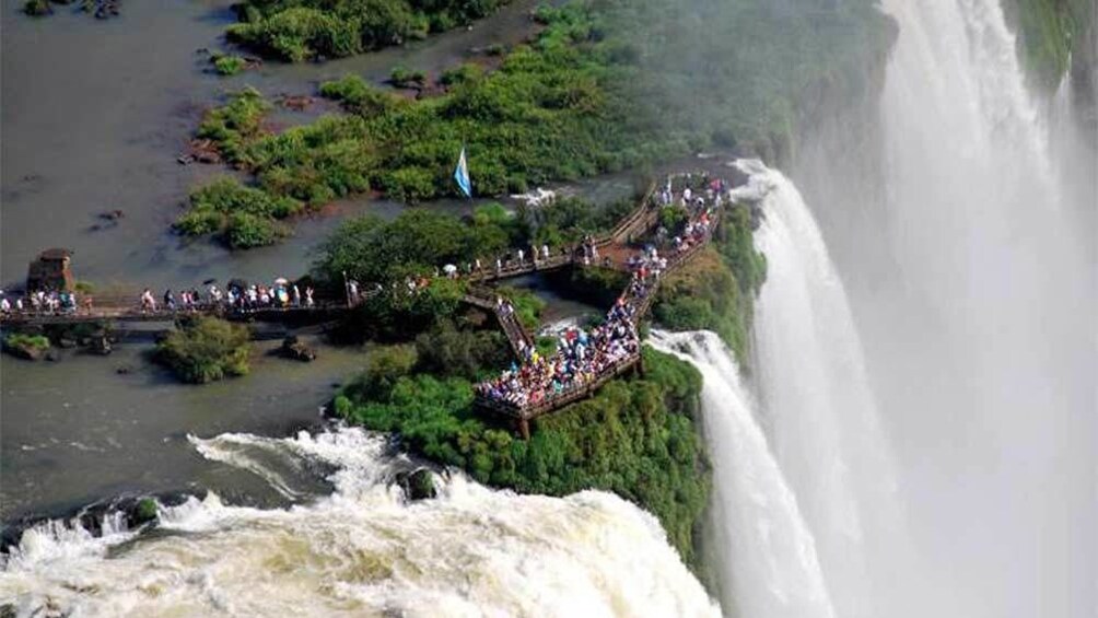 Cargar ítem 2 de 10. Day view of tourists at the Iguazu Falls in Buenos Aires, Argentina