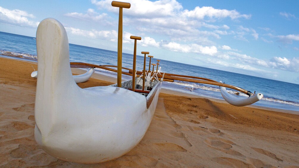 Outrigger canoe resting on the beach in Maui
