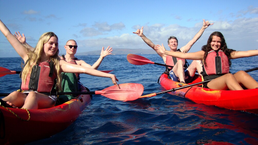 Two kayaks full of people on a Kayak Snorkel Tour in Maui