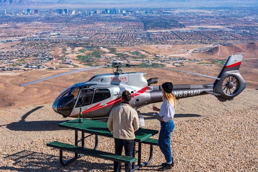 Two people look out over Red Rock Canyon