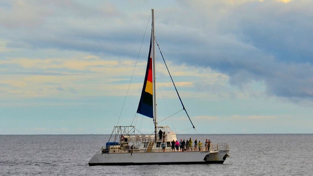 sailboat with rainbow sail in Kauai