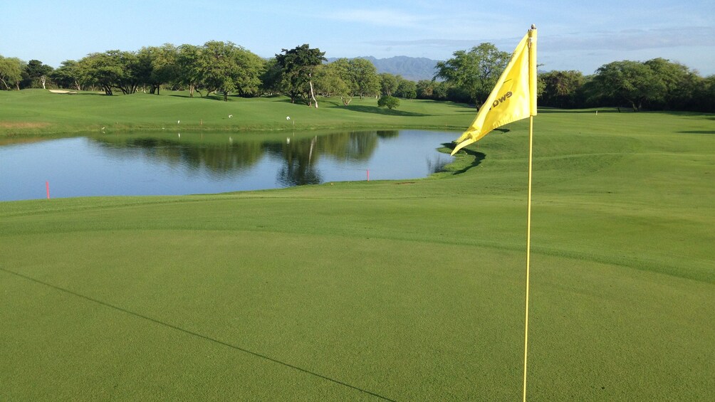 Flag at hole on Ewa Beach Golf course in Oahu