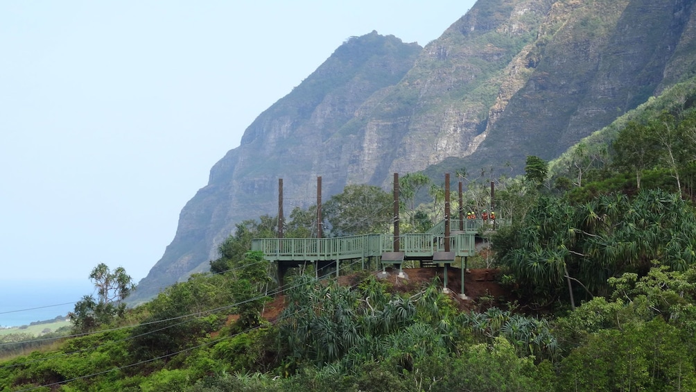 Show item 5 of 8. Zipline launch platform and mountains on Oahu
