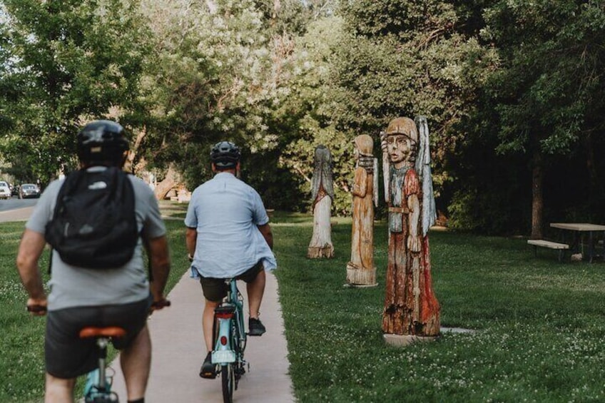 Cruising along Alameda Street admiring cottonwood sculptures.