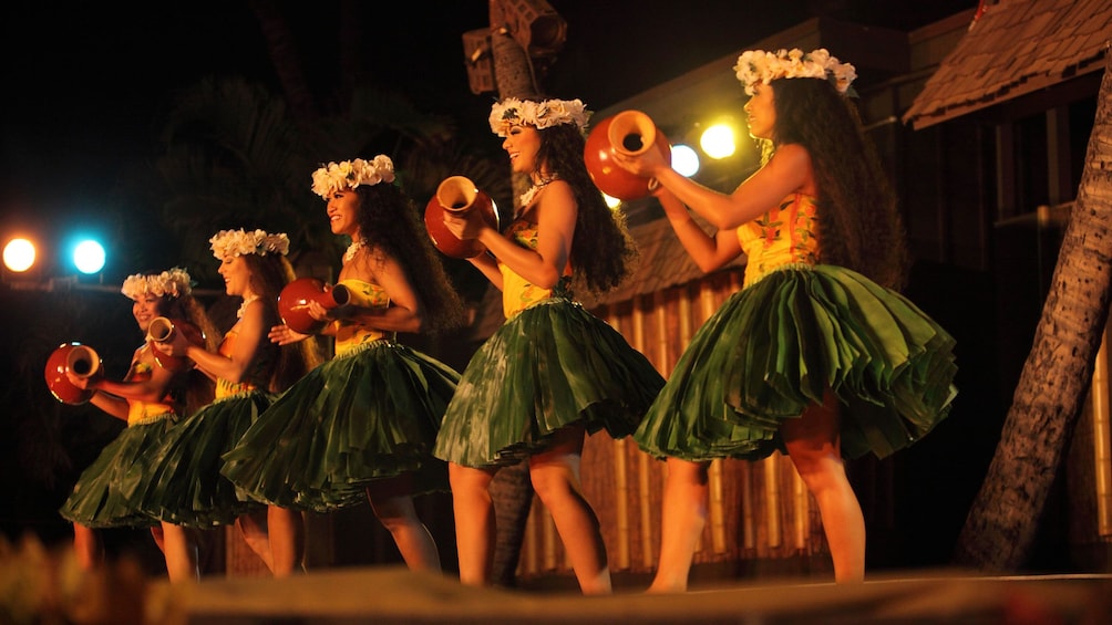 Luau performers in grass skirts