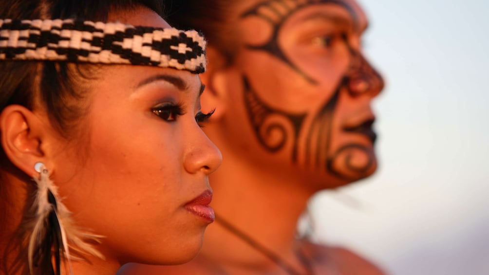 close up of faces of performers in Luau