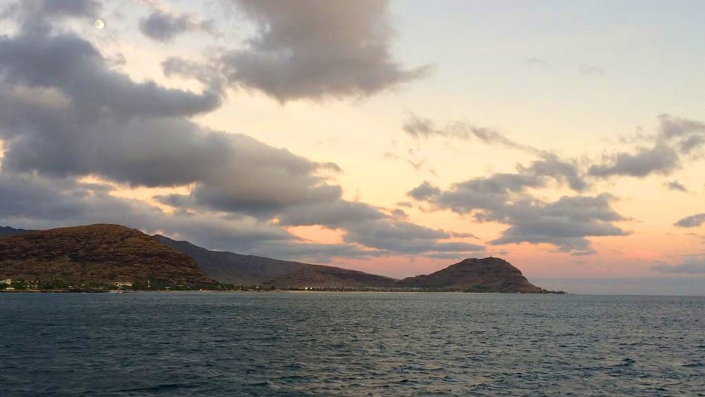 Beautiful sunset view of Oahu on the waters in Hawaii 