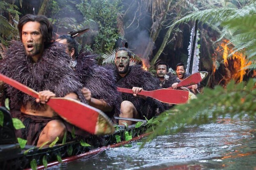 Warriors paddling the ancient war canoe
